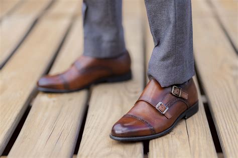 dark grey pants and brown shoes